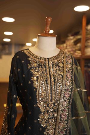 Elevate your ethnic style with this chic short top paired with a graceful Green gharara.